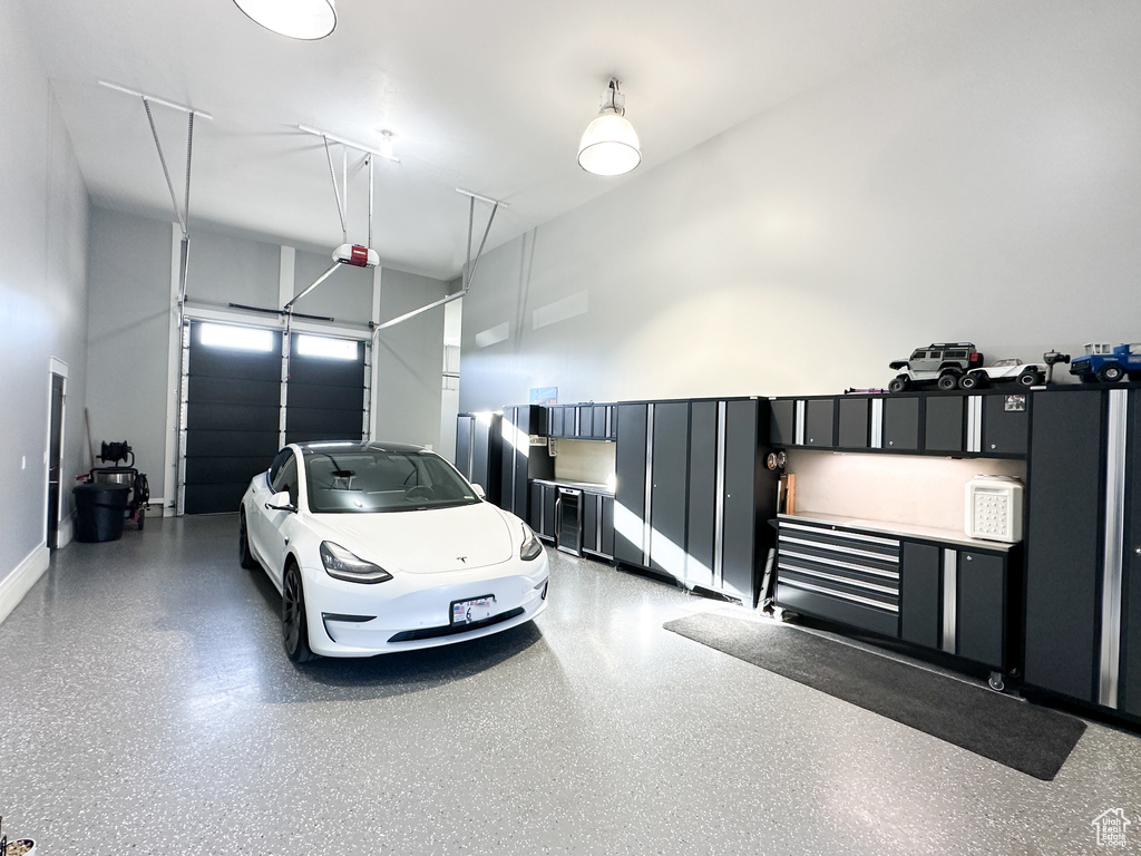 Garage featuring a garage door opener