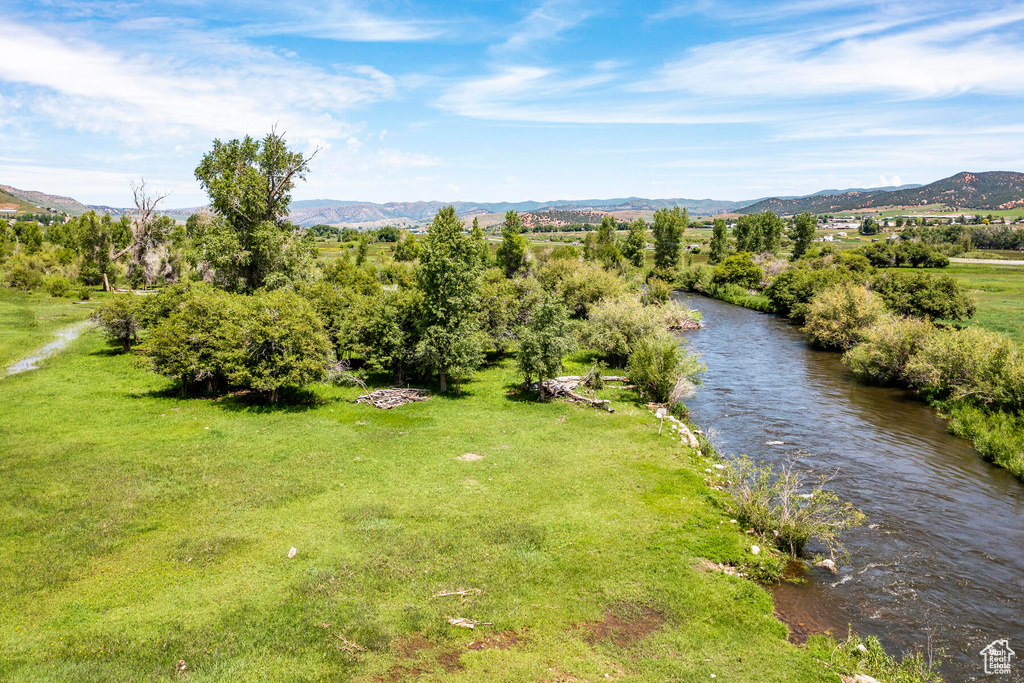 Birds eye view of property with a mountain view