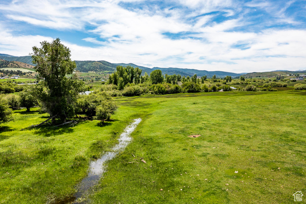 Property view of mountains with a rural view