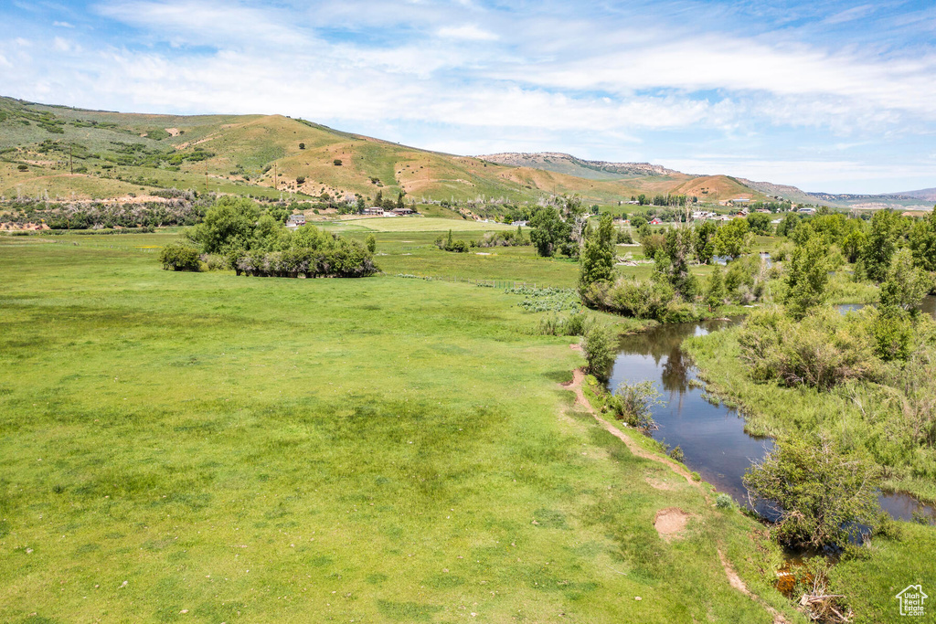 Mountain view featuring a water view and a rural view