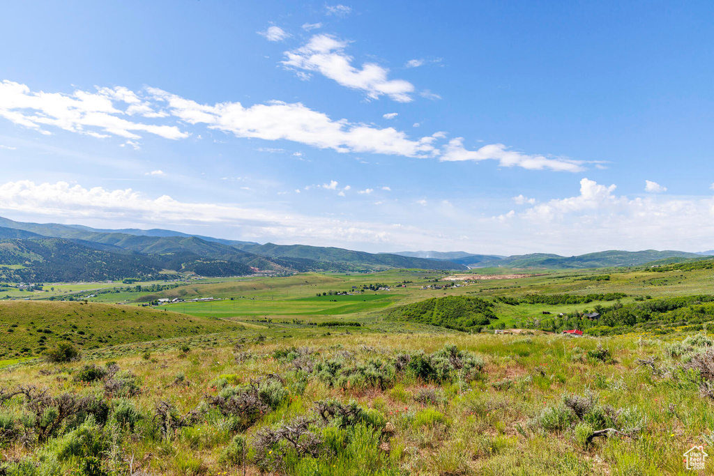 Property view of mountains with a rural view