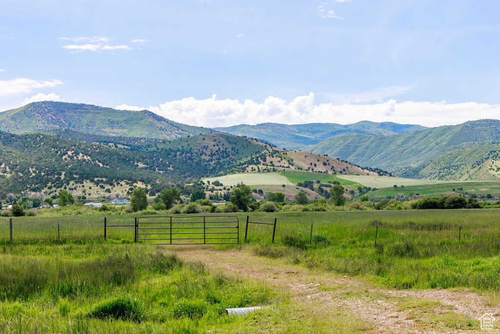 Property view of mountains with a rural view