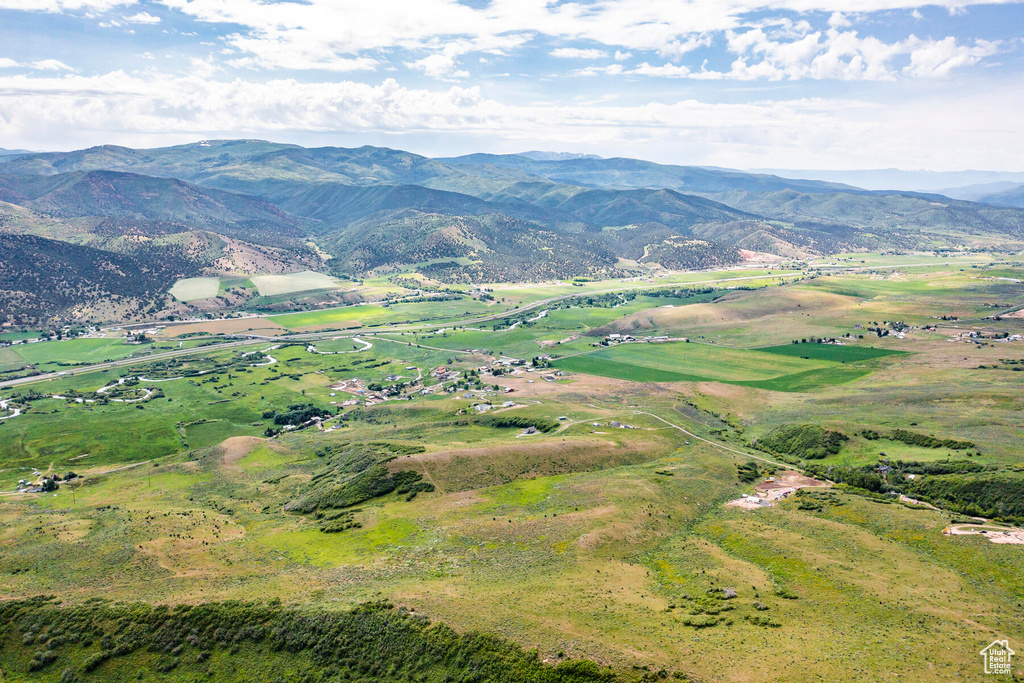 Property view of mountains with a rural view