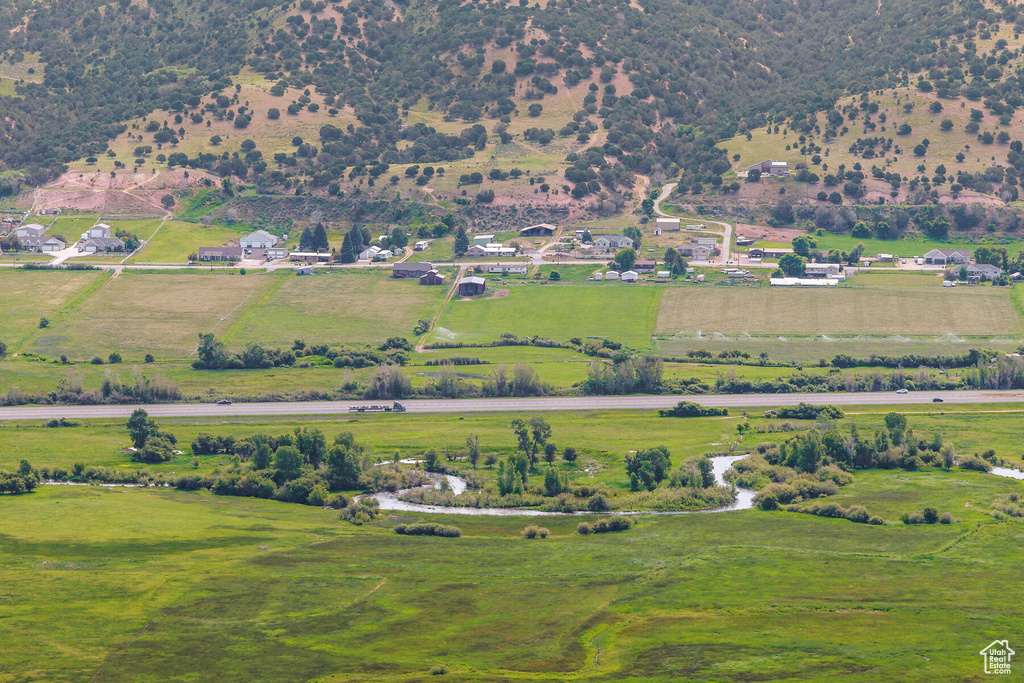 Birds eye view of property with a rural view