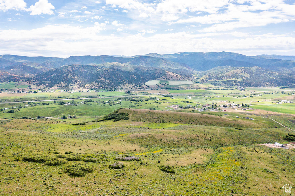 Property view of mountains with a rural view