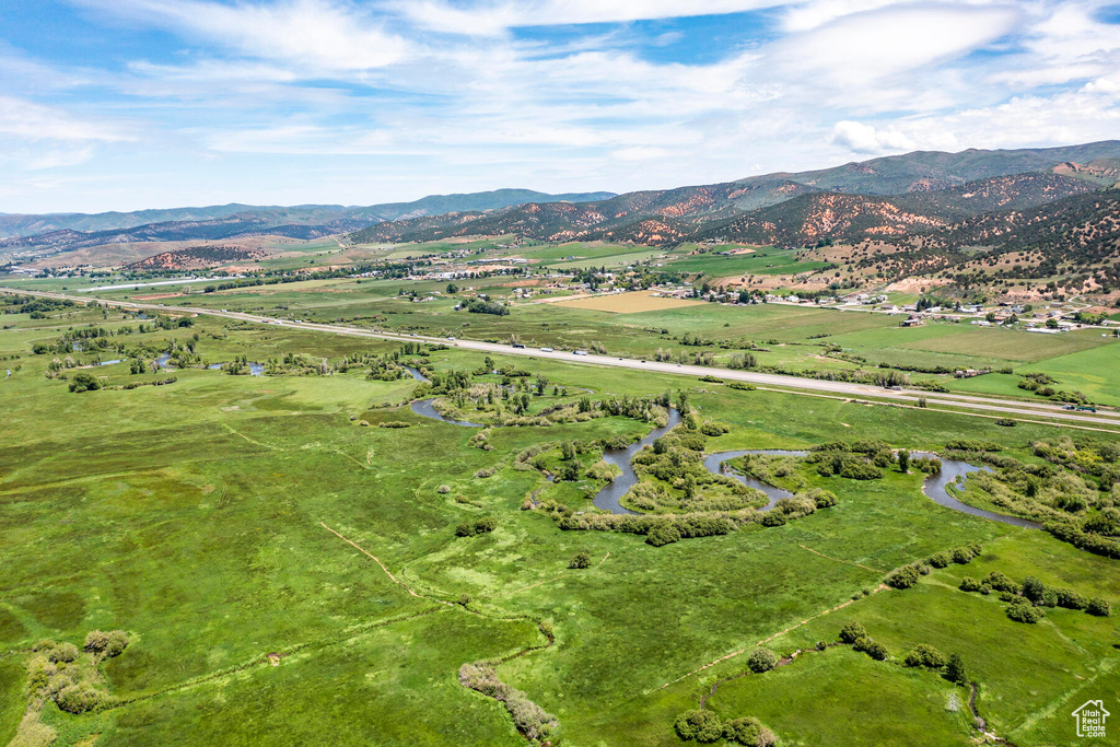 Birds eye view of property with a rural view and a mountain view