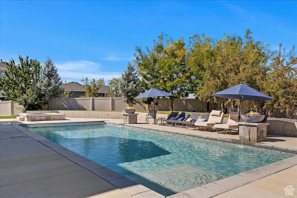 View of swimming pool with a patio