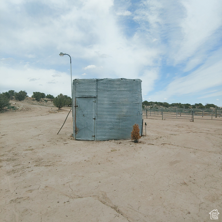 View of outbuilding with a rural view