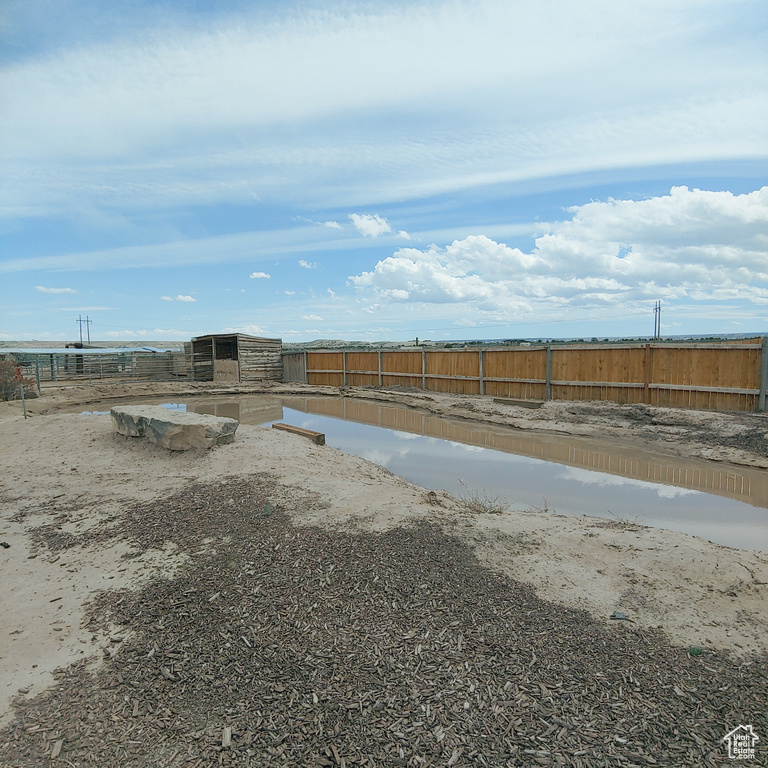 View of yard with a water view