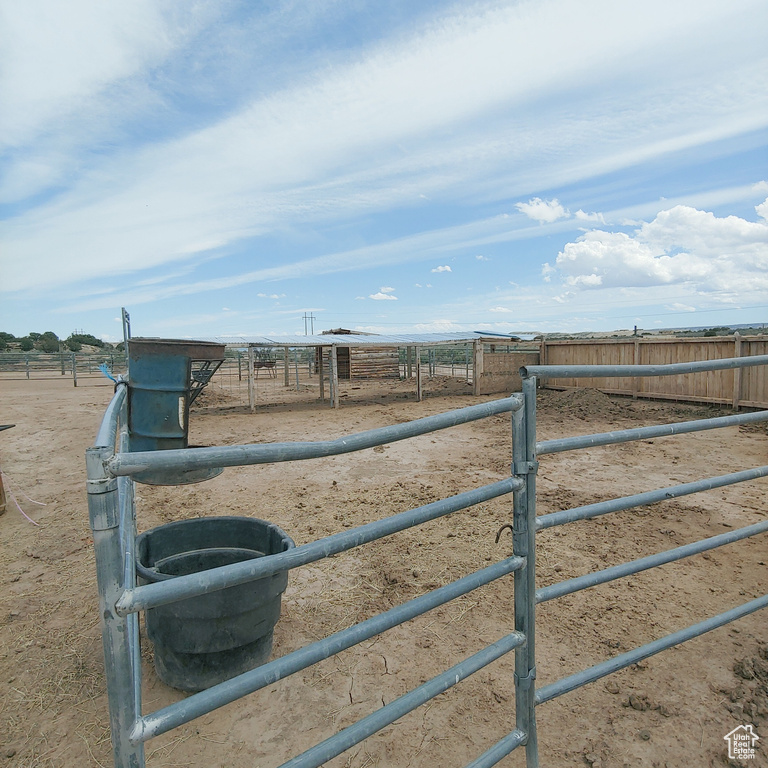 View of yard with an outbuilding and a rural view