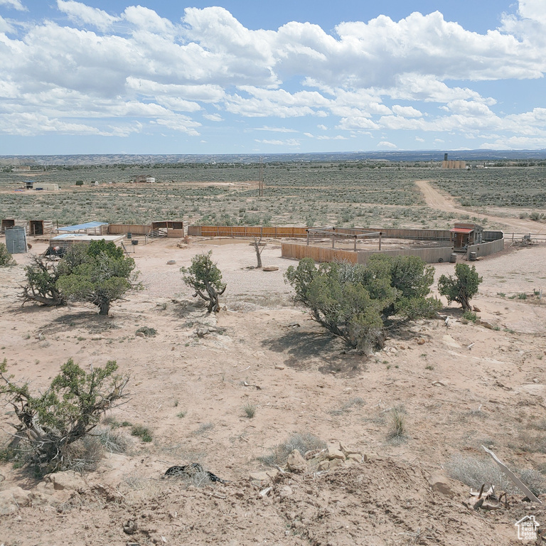 View of yard with a rural view