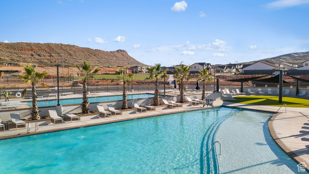 View of pool with a mountain view