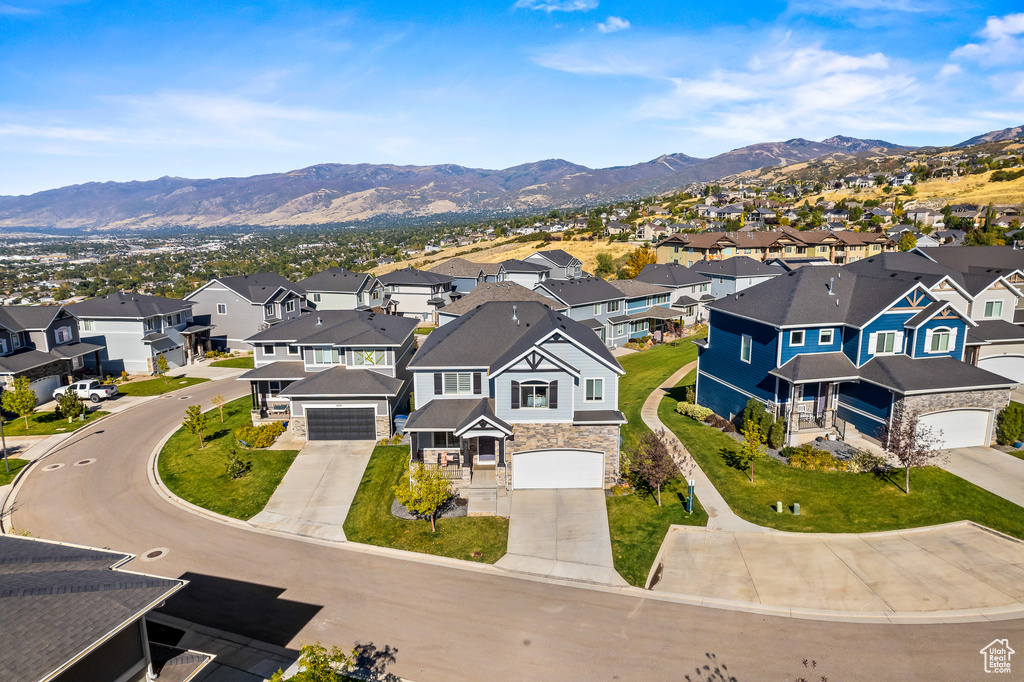 Birds eye view of property with a mountain view