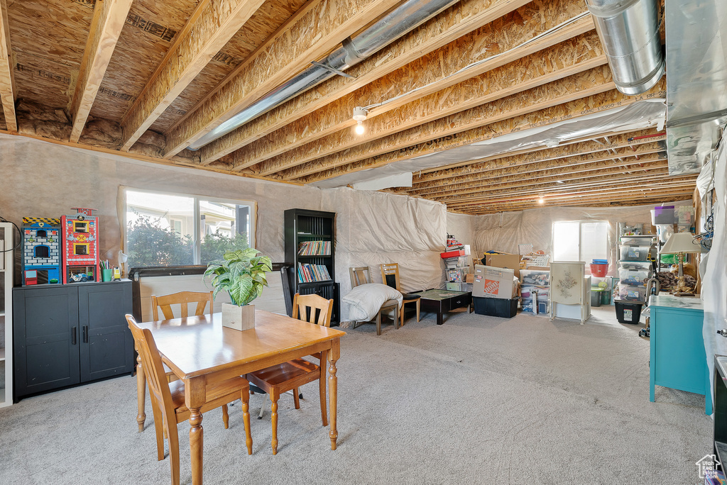 Dining space featuring light colored carpet