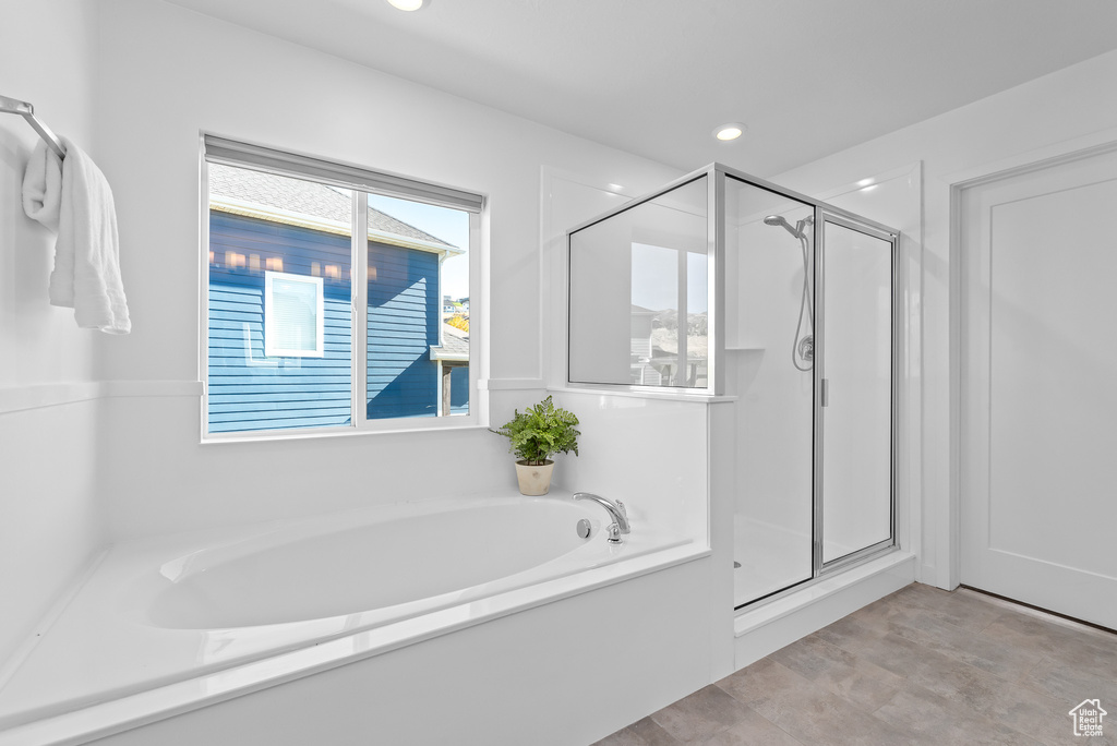 Bathroom featuring independent shower and bath