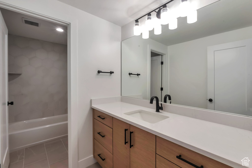 Bathroom featuring vanity and tile patterned flooring