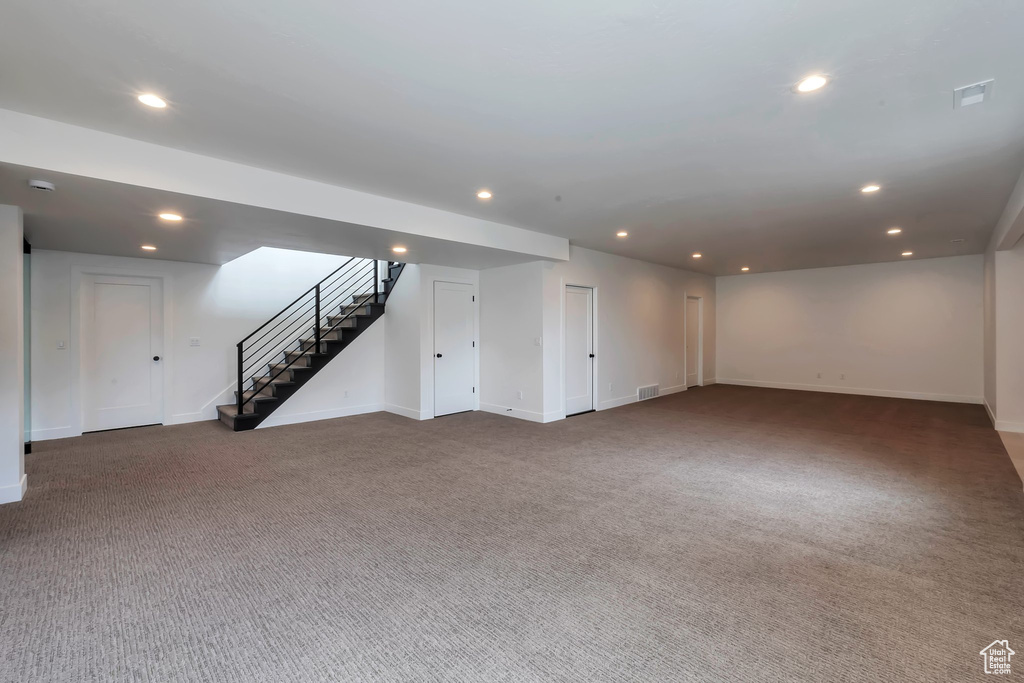 Basement featuring carpet flooring