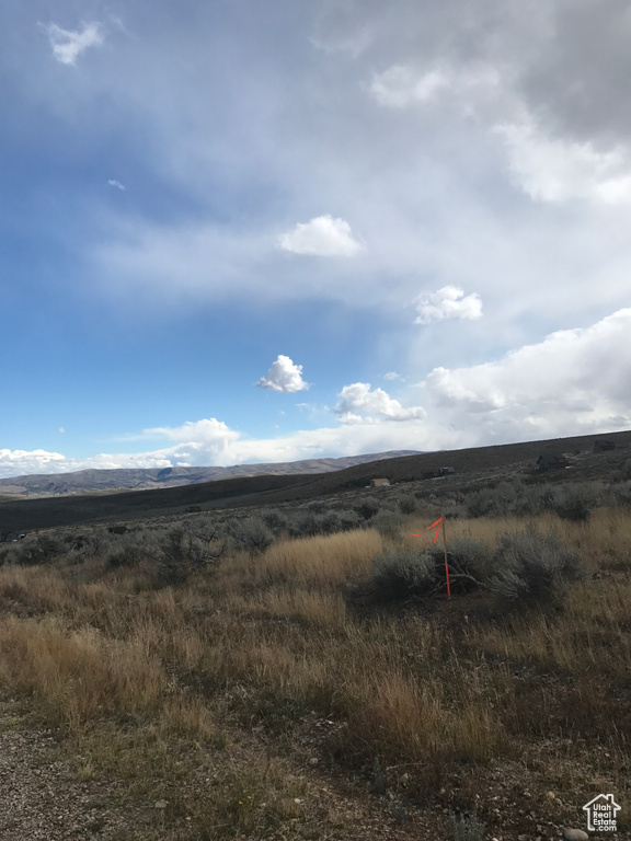 Property view of mountains with a rural view