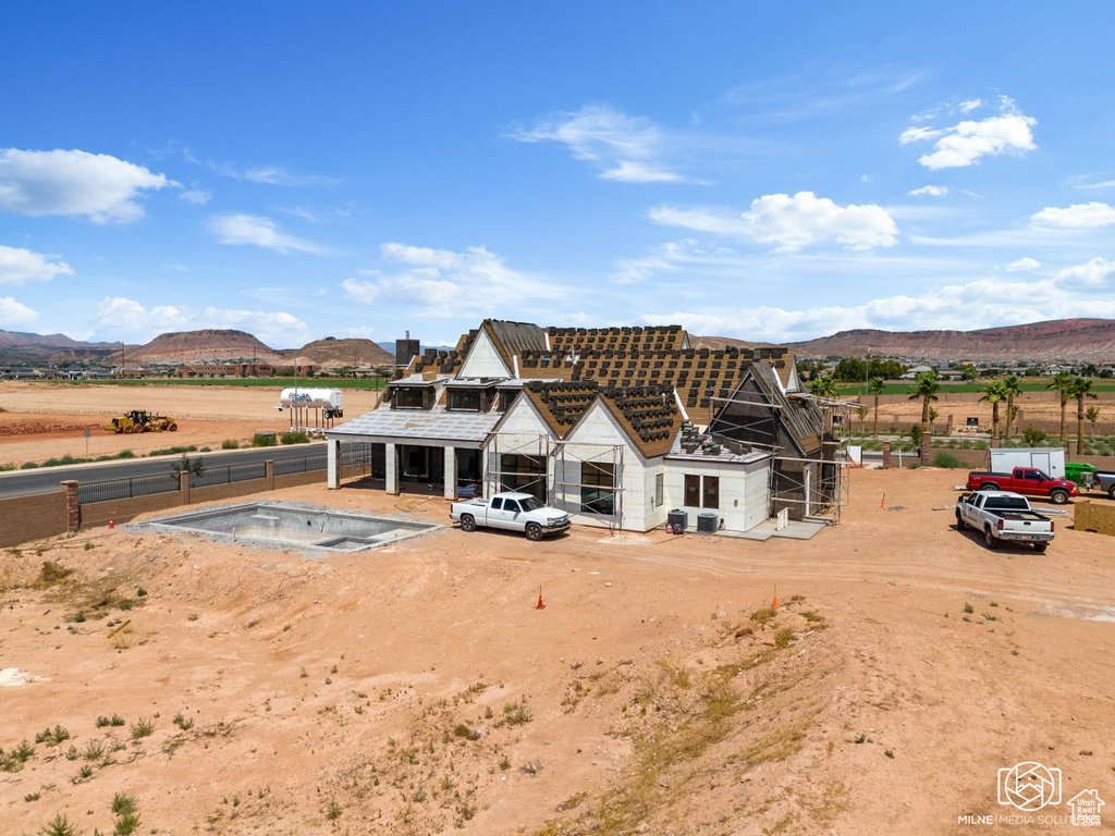 Rear view of property featuring a mountain view