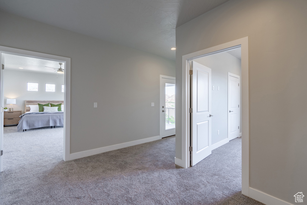 Spare room with carpet floors and ceiling fan