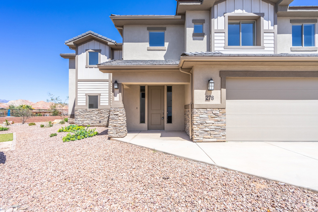 View of front of home featuring a garage