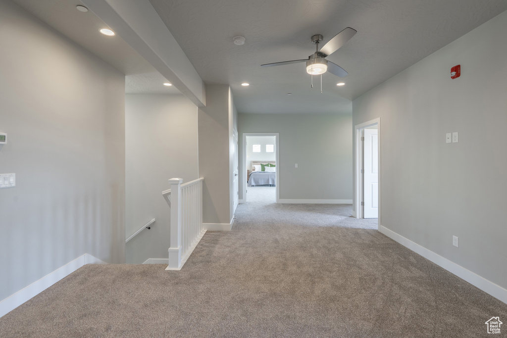 Hallway with light colored carpet
