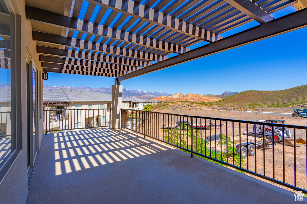 View of patio / terrace with a mountain view, a balcony, and a pergola