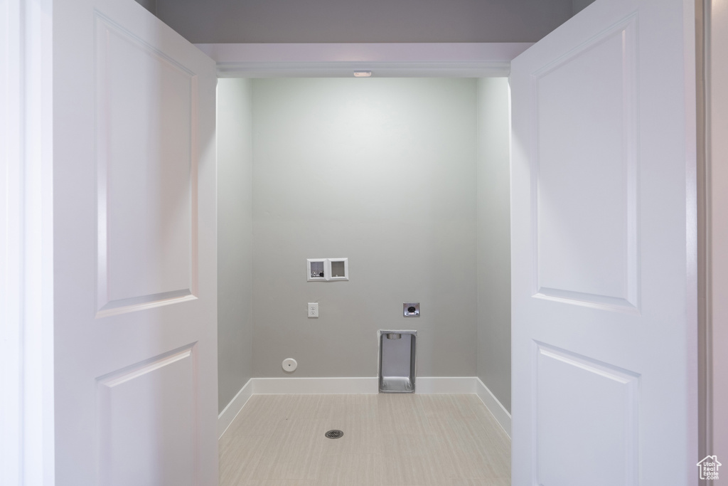 Washroom featuring gas dryer hookup, electric dryer hookup, and washer hookup