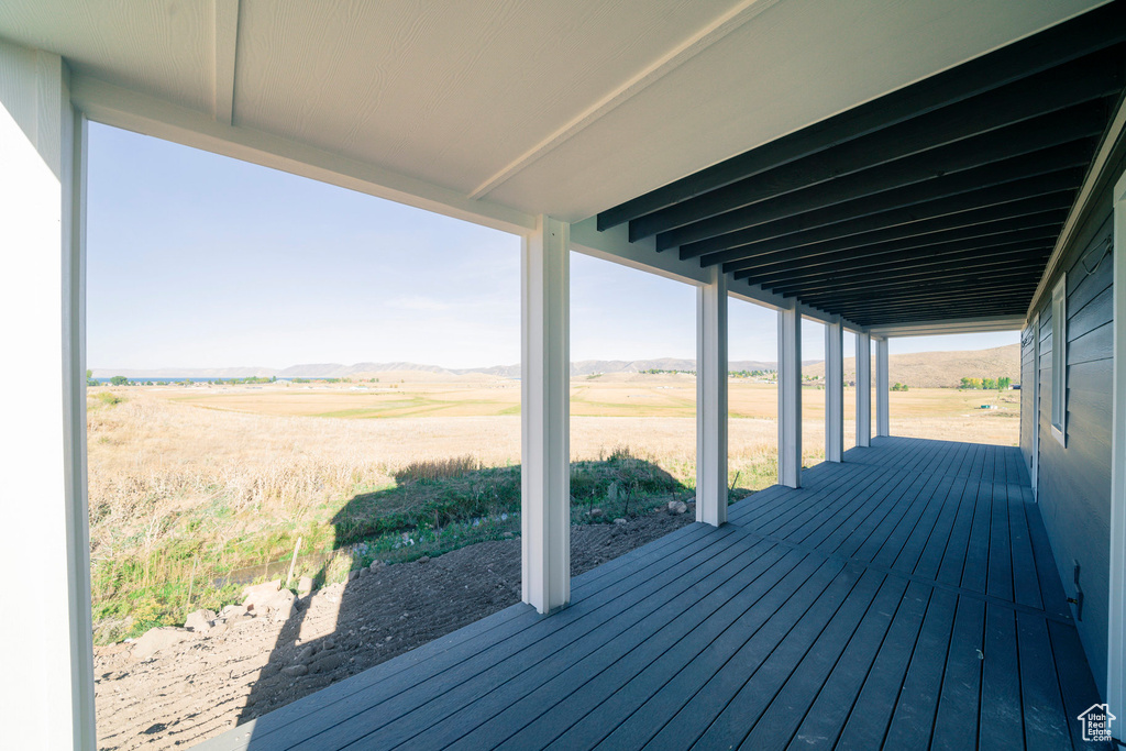 Wooden deck featuring a rural view