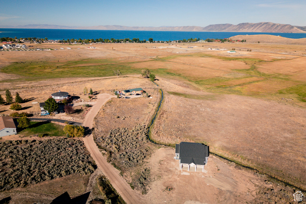 Aerial view with a water and mountain view and a rural view