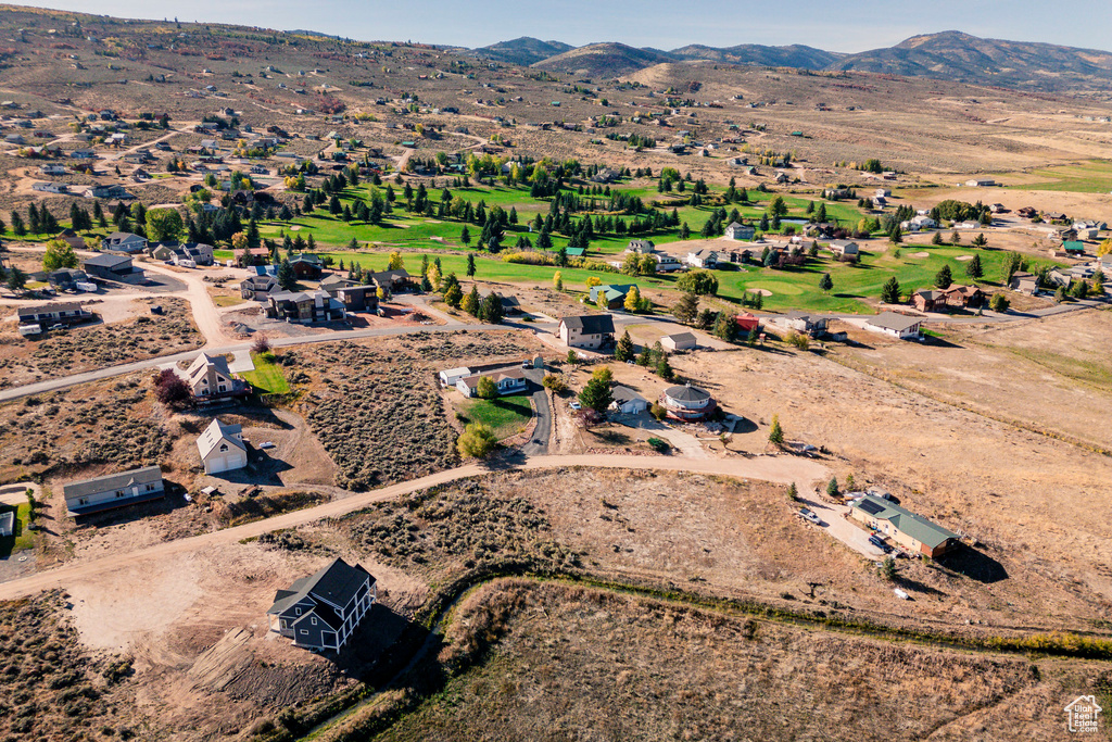 Birds eye view of property featuring a mountain view