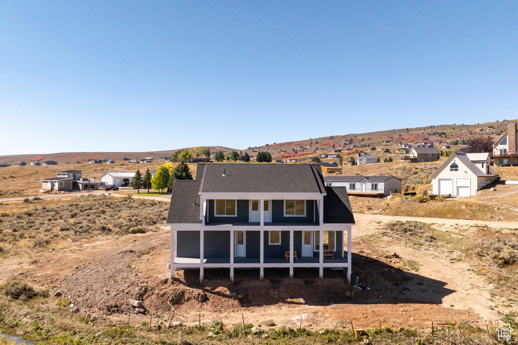 Back of house featuring a mountain view