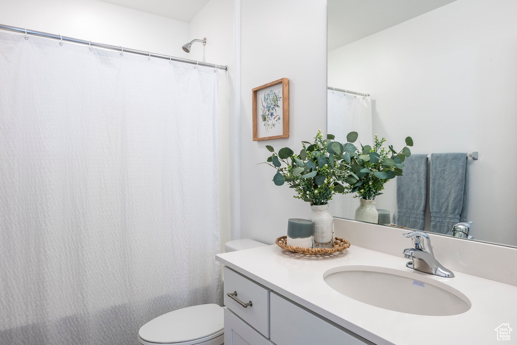 Bathroom featuring vanity and toilet