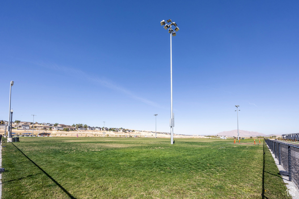 View of home's community with a yard