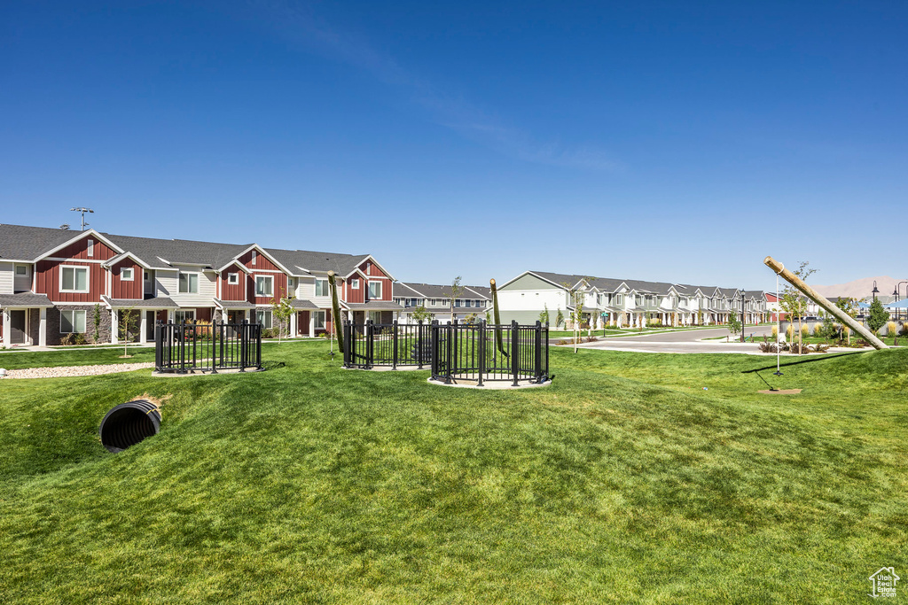 View of community featuring a yard