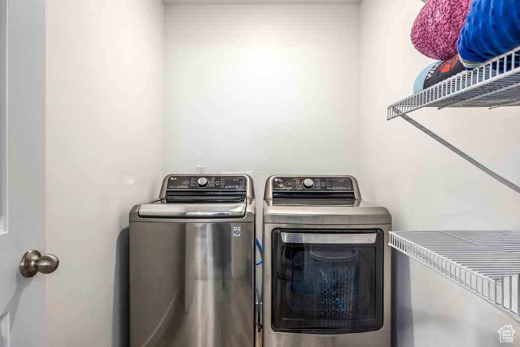 Washroom featuring washer and dryer