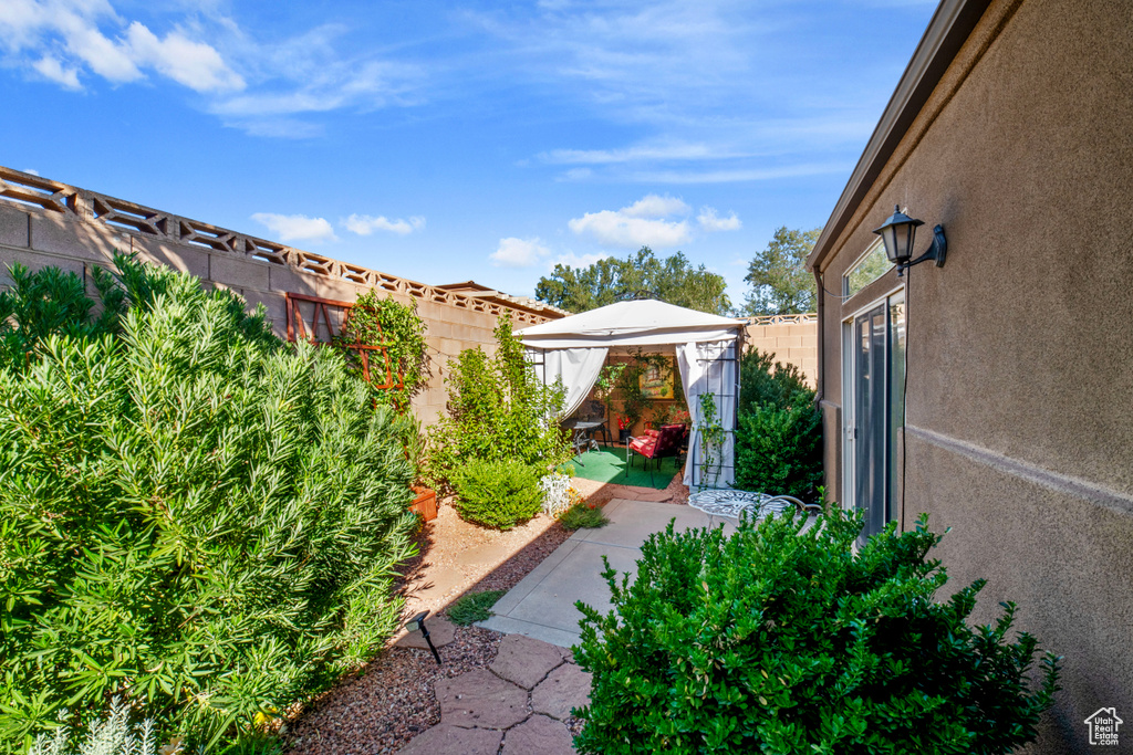 View of yard with a patio area