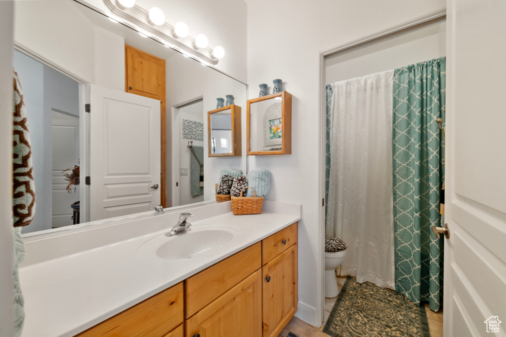 Bathroom featuring vanity and toilet