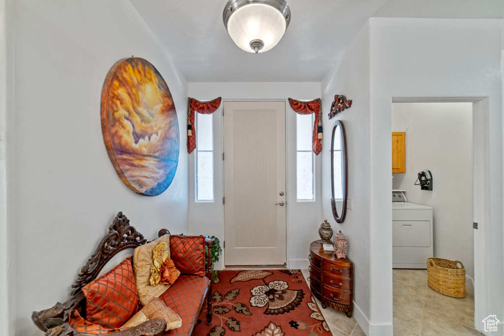 Entryway with washer / dryer and a healthy amount of sunlight