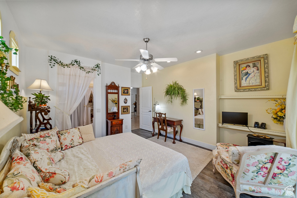 Bedroom featuring ceiling fan and hardwood / wood-style floors