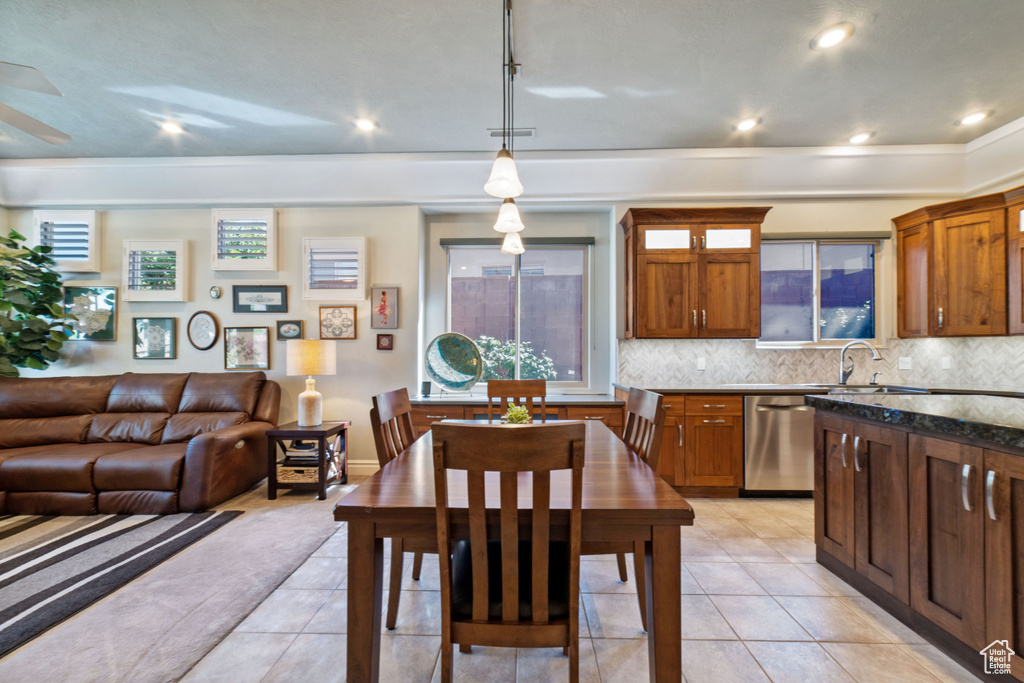 Dining room with sink and light tile patterned floors