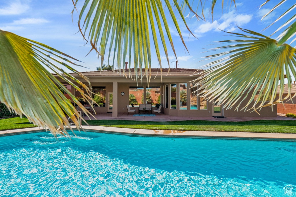 View of swimming pool with a patio