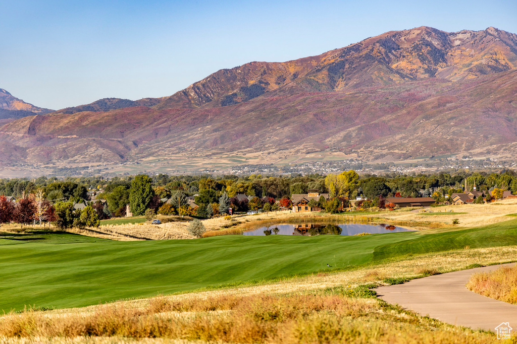 Property view of mountains featuring a water view