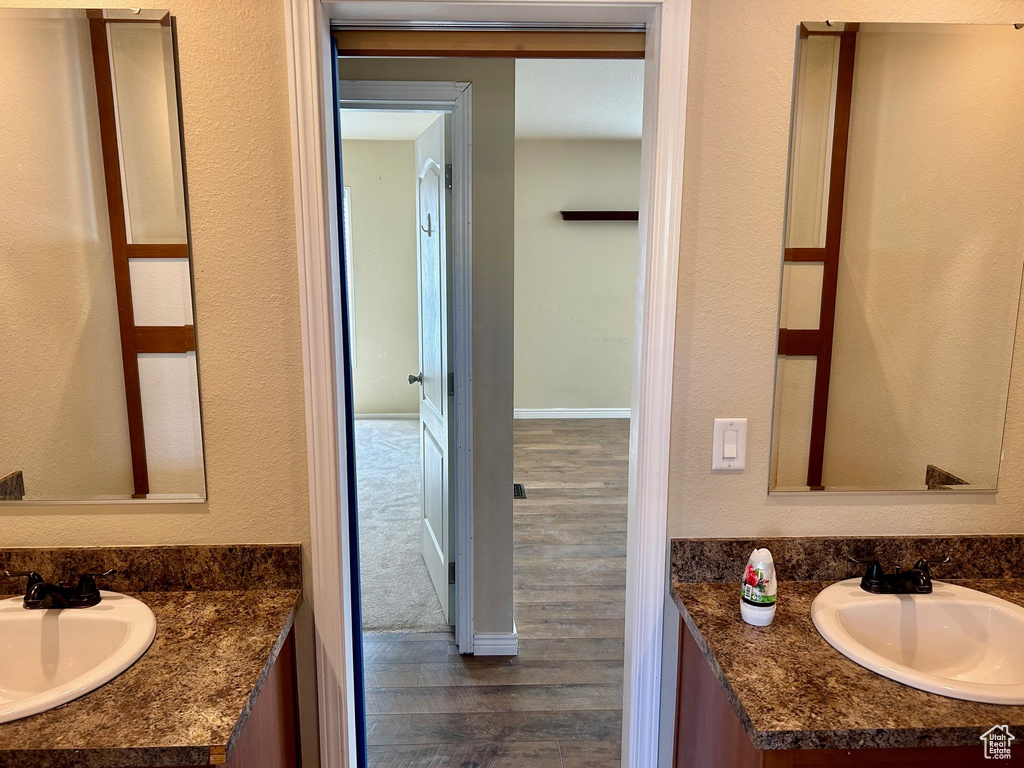 Bathroom featuring vanity and hardwood / wood-style flooring