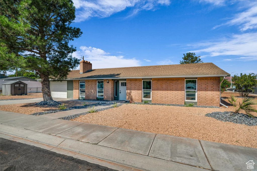 Ranch-style home featuring a garage