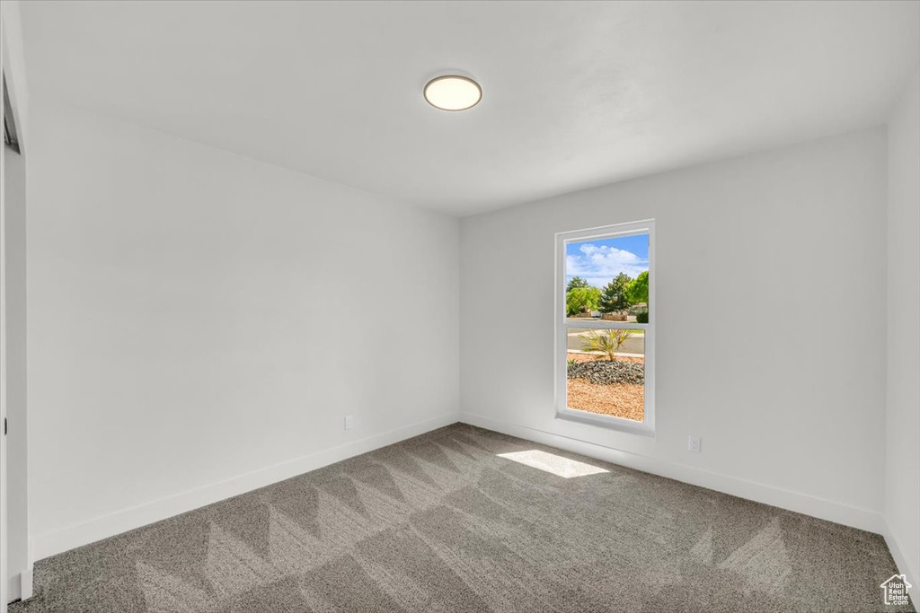 Unfurnished room featuring carpet floors