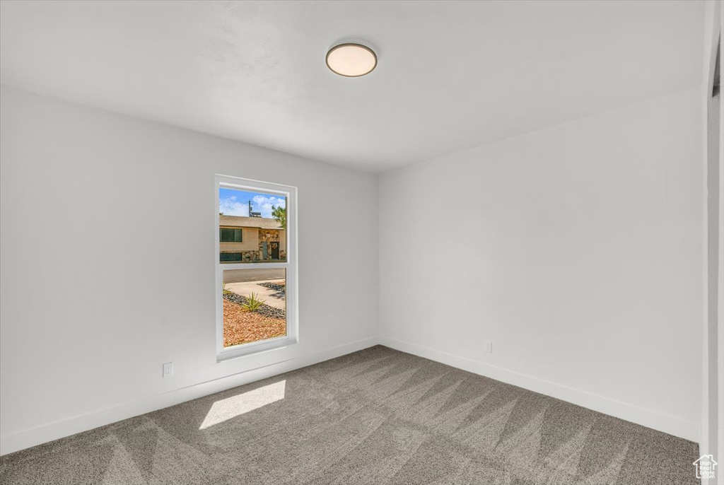 Unfurnished room featuring carpet flooring