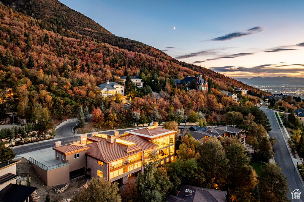 Aerial view at dusk featuring a mountain view