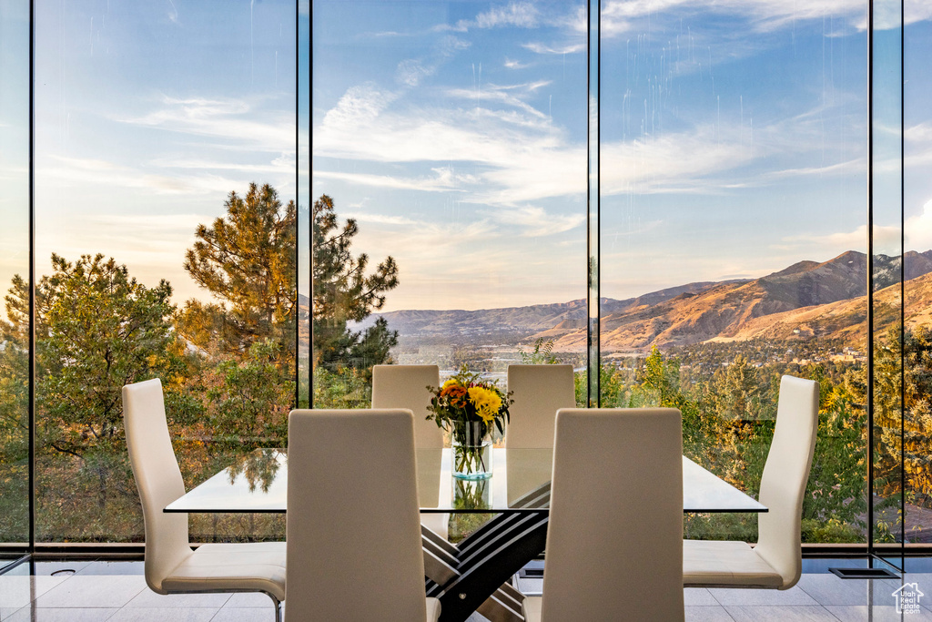 Interior space featuring light tile patterned flooring and a mountain view