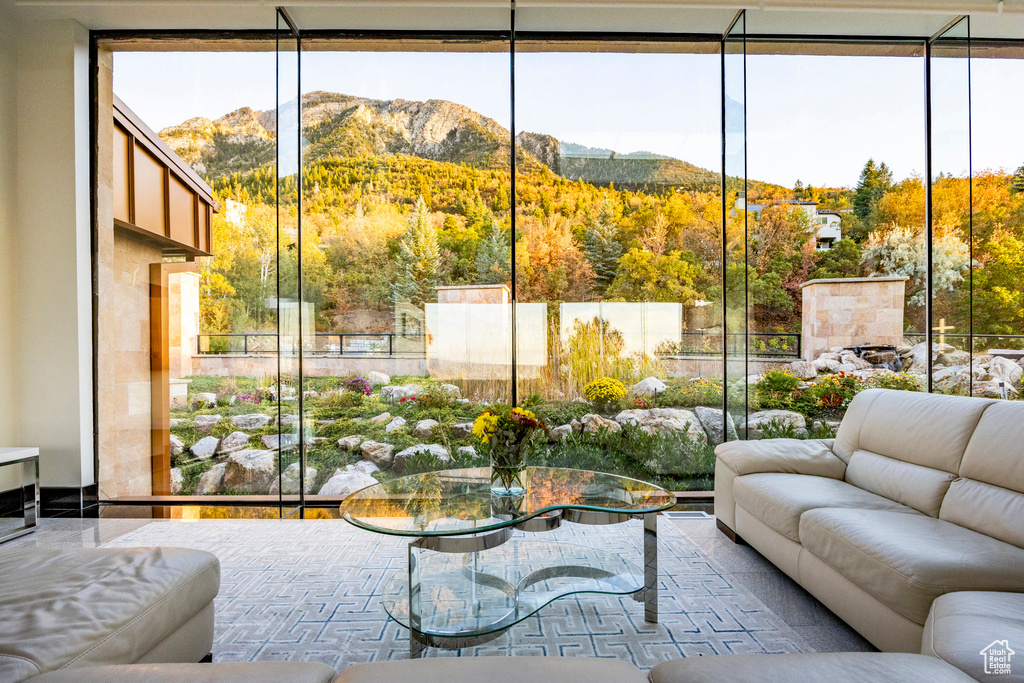 Sunroom / solarium featuring a mountain view